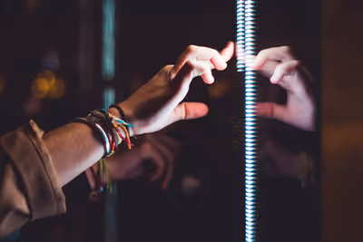 Hand on glass article image