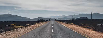 A road to a mountain with a wide view